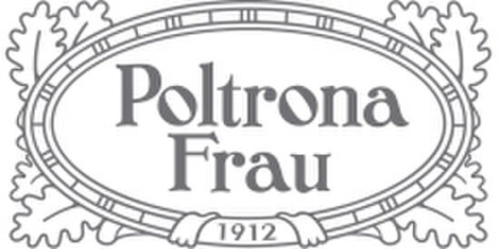 Poltrona Frau e Fornasetti rilanciano la poltrona 1919 e il baule Isidoro in chiave moderna